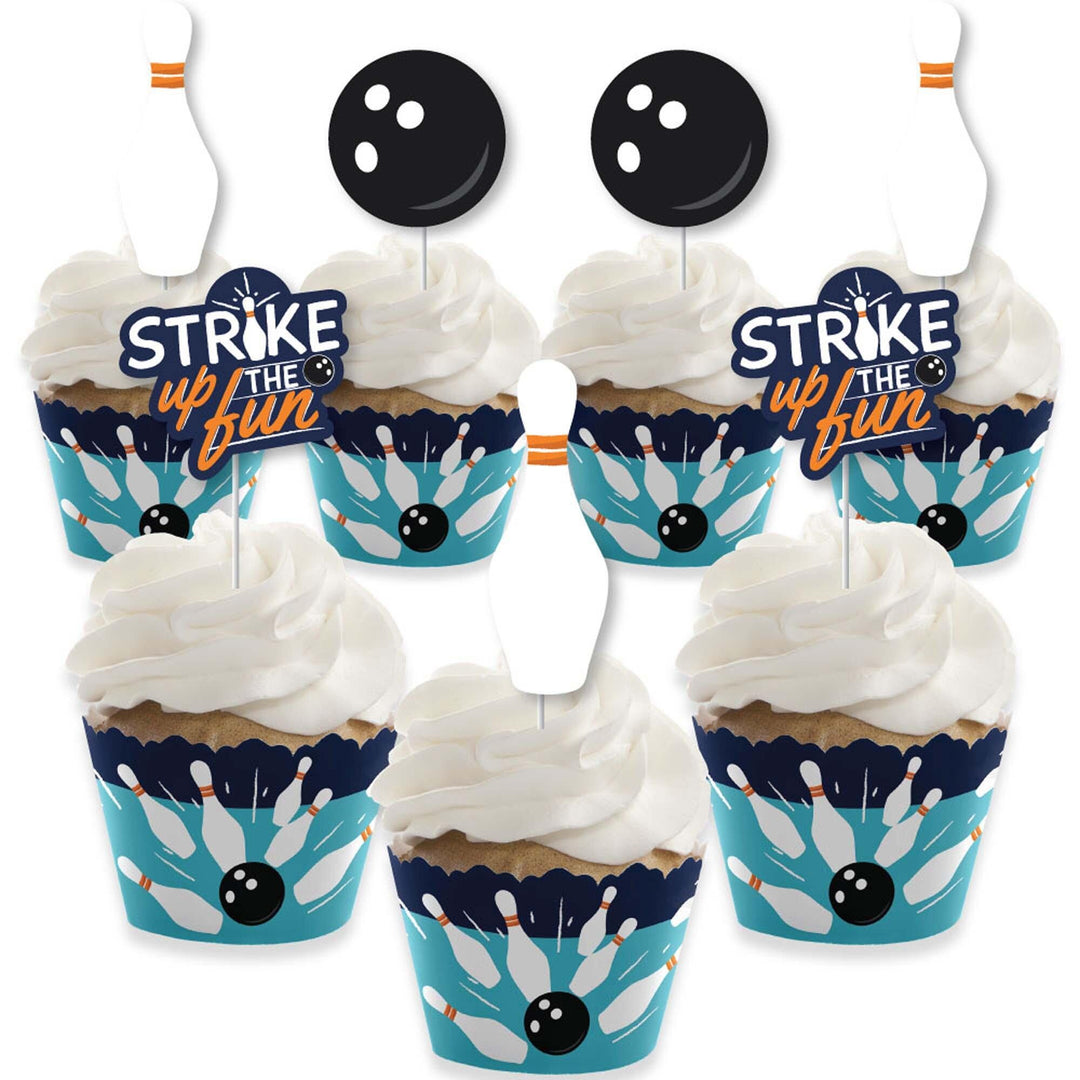 A set of cupcake decorations with bowling-themed cupcake wrappers and treat picks displayed on a white background.
