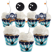 A set of cupcake decorations with bowling-themed cupcake wrappers and treat picks displayed on a white background.