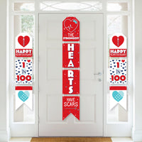 A series of vertical paper banners with red, white, and blue colors and heart motifs, celebrating 'Happy Heartiversary'.