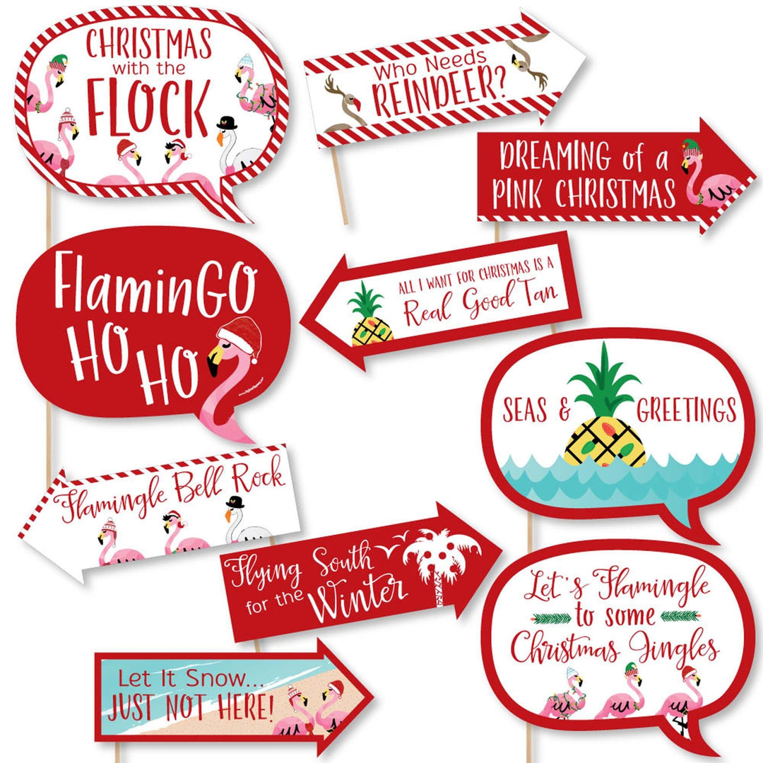 A collection of 10 printed and cut photo booth props featuring flamingo-themed Christmas phrases and characters.
