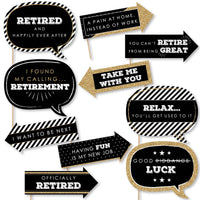 A collection of 10 printed and cut photo booth props with various humorous retirement-related phrases printed on them, including props shaped like signs and bubbles for speech.