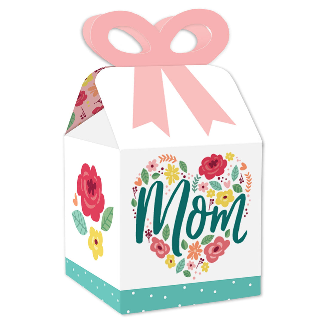 A square favor gift box with a colorful floral design and the word 'Mom' in the center, adorned with a pink ribbon on top.