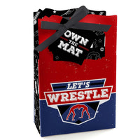 A favor box with a red and blue color scheme featuring wrestling-themed graphics and a black ribbon.