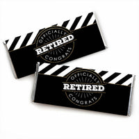 Two candy bar wrappers with a black and white striped design and the word 'RETIRED' prominently displayed in the center.