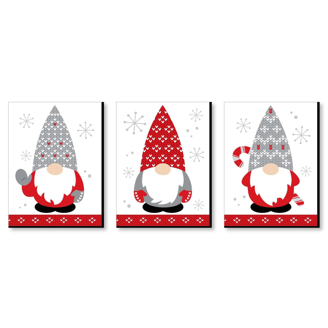 Set of three Christmas-themed wall art prints featuring cartoon gnomes in festive attire against a snowy background, with red, white, and grey colors predominately used.