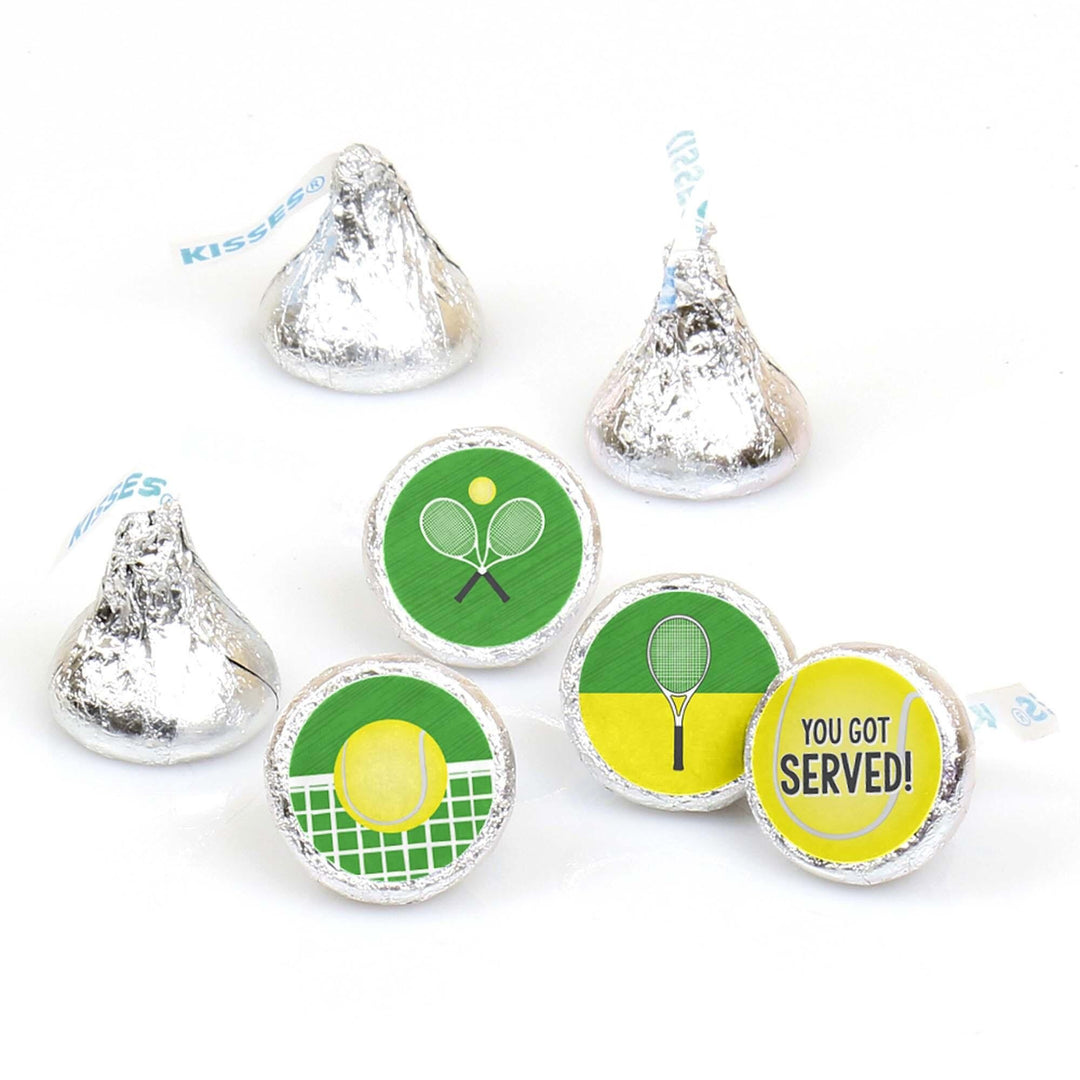 A collection of round candy stickers with tennis-themed designs, including images of a tennis racket, tennis ball, and court, and the phrases 'You Got Served' and 'You Got served' again.