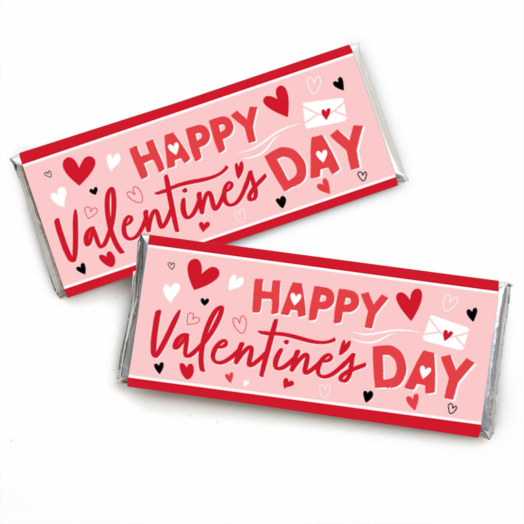  wrappers designed for candy bars with 'Happy Valentine's Day' text and Valentine's Day themed decorations such as hearts, love letters, and scalloped edges, in pink, red, white, and silver colors.