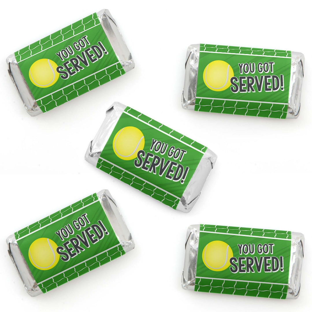 Multiple mini candy bar wrappers with a green and white color scheme and tennis ball graphics, labeled 'YOU GOT SERVED!'.
