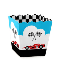 A mini favor box with a racecar theme, featuring a graphic of a red racecar, checkered flags, and a blue and white design resembling a race track.