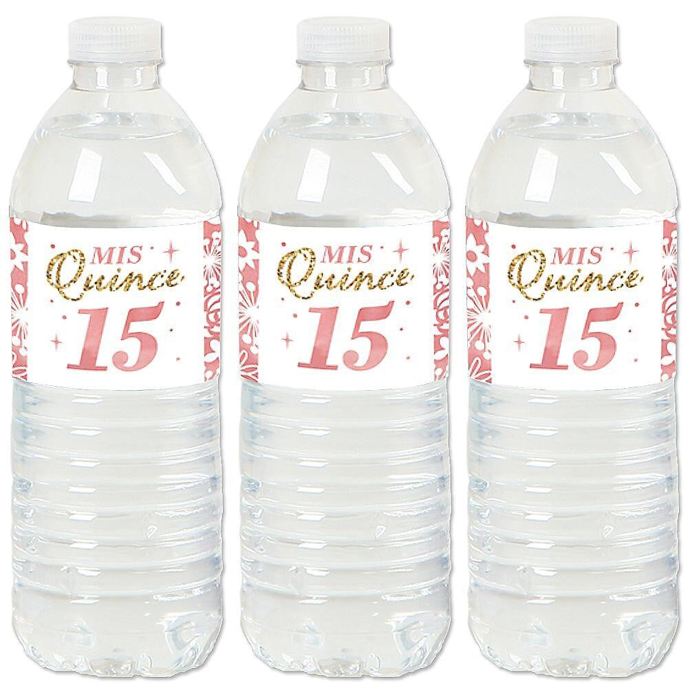 Three water bottles with pink and gold 'Mis Quince Anos' sticker labels attached to them.