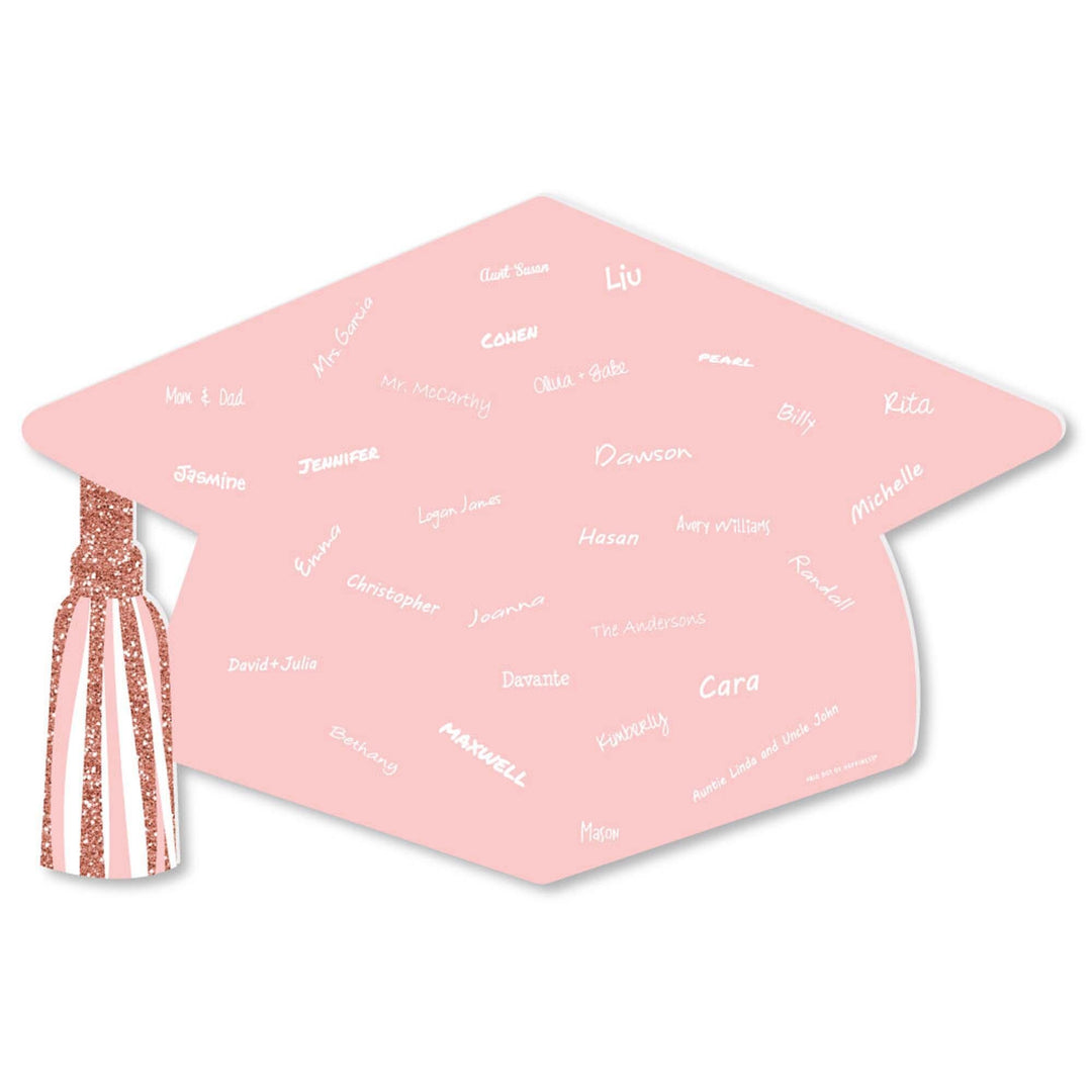 A rose gold graduation cap-shaped plastic guest book with 'GRAD' printed on top and a list of names inside. It has a white finished edge and a decorative tassel attached to one corner.