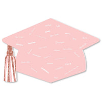 A rose gold graduation cap-shaped plastic guest book with 'GRAD' printed on top and a list of names inside. It has a white finished edge and a decorative tassel attached to one corner.