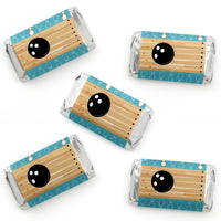 Mini candy bar wrappers with a bowling theme, featuring a bowling ball and lane, printed in blue, brown, orange, and black colors.
