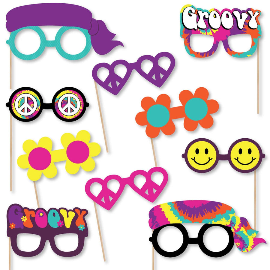 A collection of colorful 1960s themed photo booth props including various glasses and masks with vibrant prints and designs.