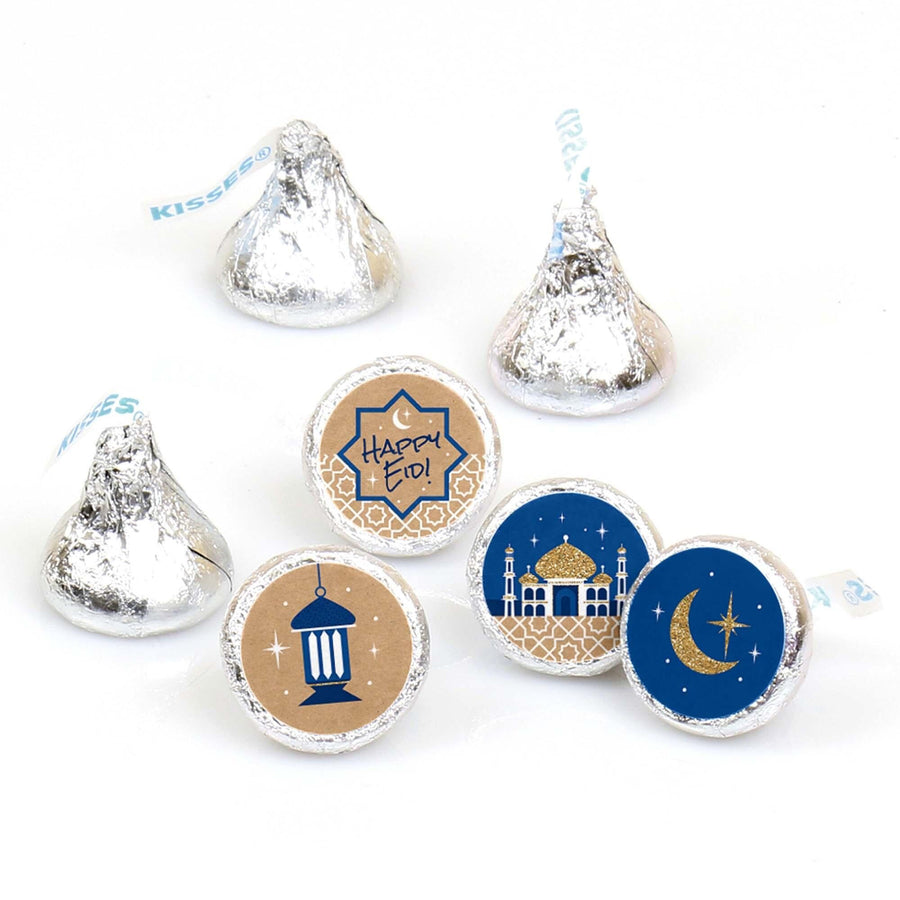A collection of round candy labels with various Ramadan-themed designs, including the crescent moon, a mosque, and the text 'Happy Eid', intended to fit Hershey Kisses or similar candies.