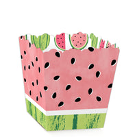 A mini favor box with a watermelon design, featuring a pink base with green top and black seed patterns.