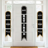 A set of vertical hanging paper banners with 'HAPPY RETIRED' text arranged in a sequence on a white door, decorated with black and gold patterns.