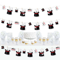 A set of decorative garland banners featuring paper cut-outs of magic hats and magic wands, with a white cord and mini clothespins, arranged for a party decoration setup.