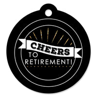A round, black card stock gift tag with 'CHEERS TO RETIREMENT!' written in white and gold, with a hole at the top for hanging.