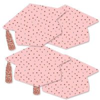 A set of rose gold graduation cap-shaped decorations for a party with a pattern printed on them.