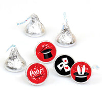 A collection of round candy stickers with red, white, and black designs, including a magic wand, a vanishing act, and a rabbit in a hat, intended to fit Hershey's Kisses candies.