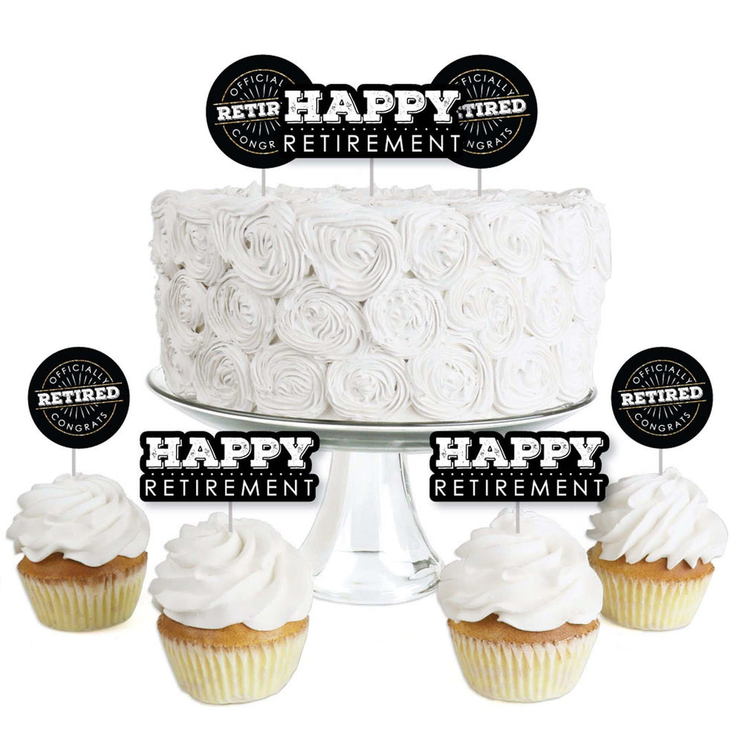 A set of clear treat picks with 'Happy Retirement' text, displayed on a white cupcake with more cupcakes decorated with the same toppers in the background.
