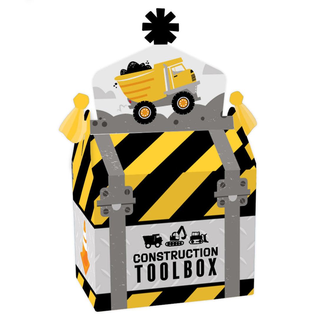 A construction-themed treat box with a construction truck design, striped pattern, and the text 'CONSTRUCTION TOOLBOX'.