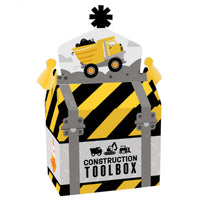 A construction-themed treat box with a construction truck design, striped pattern, and the text 'CONSTRUCTION TOOLBOX'.