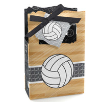 A favor box with a volleyball design, beige and black color scheme, with a ribbon on top.