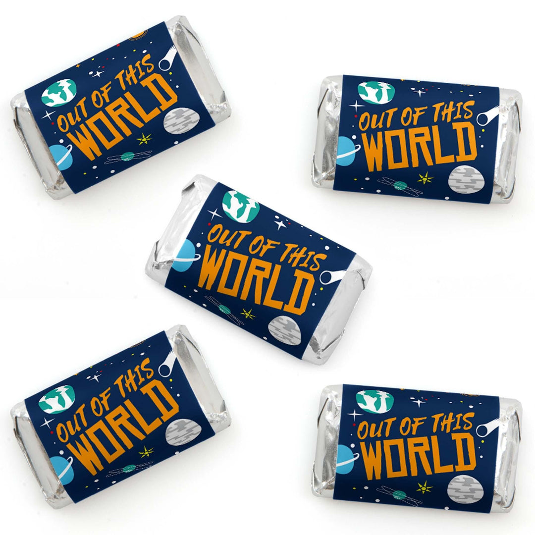 Set of four mini candy bar wrappers with 'Blast Off to Outer Space' text and space-themed decorations, including planets and a rocket ship.